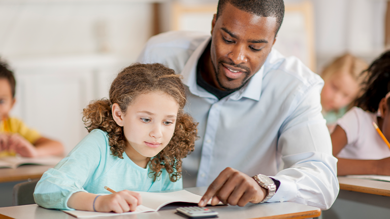 Teacher working with student